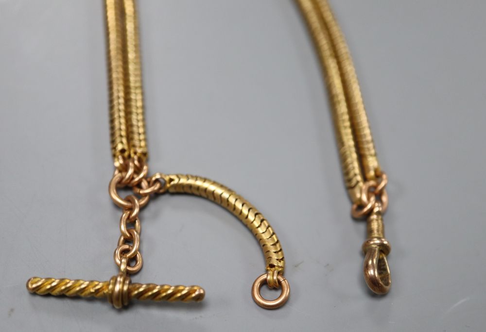 An early 20th century yellow metal snakelink chain, with added T-bar, 47cm, gross 21.4 grams.